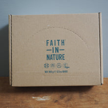 Load image into Gallery viewer, Cardboard box with 'Faith in Nature' branding on a wooden surface and gray background