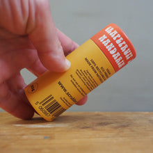 Load image into Gallery viewer, A hand holding a yellow and orange tube of Scrublet Mandarin hand wash over a wooden surface.