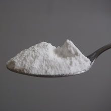 Load image into Gallery viewer, Spoonful of white powder on a gray background