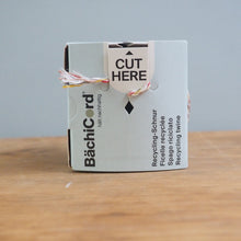 Load image into Gallery viewer, Box of Bächicard on a wooden surface with a gray background