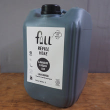 Load image into Gallery viewer, A gray plastic canister of Full Load & Wash laundry liquid refill, featuring a white label with black text, resting on a wooden surface next to a gray floor.