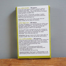Load image into Gallery viewer, Product packaging with text on a wooden surface and gray background