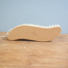 Load image into Gallery viewer, Bamboo brush leaning against a wooden surface with a light blue background