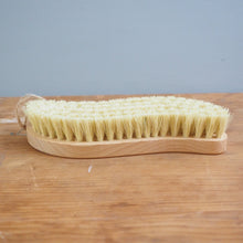 Load image into Gallery viewer, Bristle brush leaning against a wooden surface with a gray background