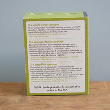 Load image into Gallery viewer, Green box with text on a wooden surface and gray background