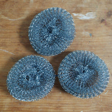 Load image into Gallery viewer, Three metallic scrubber pads on a wooden surface
