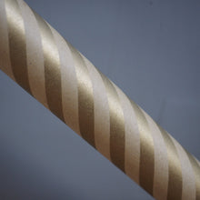 Load image into Gallery viewer, A close-up of a twisted rope or cable with alternating metallic gold and silver stripes, set against a solid dark gray background.
