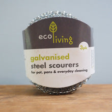 Load image into Gallery viewer, Pack of eco living galvanized steel scourers on a wooden surface with a gray background

