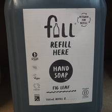 Load image into Gallery viewer, Hand soap refill container with a label on a dark background

