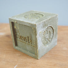 Load image into Gallery viewer, Cube-shaped soap with 'La Corvette' branding on a wooden surface
