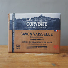 Load image into Gallery viewer, A 200g box of La Corvete Savonnerie du Midi Savon Vaisselette dishwashing soap, featuring a brown kraft-paper style design with a dark blue top section and white text, standing on a wooden surface against a gray background.
