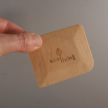 Load image into Gallery viewer, A hand holding a small rectangular wooden box with rounded corners and the words 'ecoliving' printed on the front, against a plain gray background.
