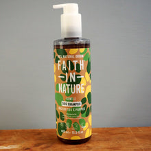 Load image into Gallery viewer, Bottle of Faith in Nature gentle dog shampoo on a wooden surface with a gray background
