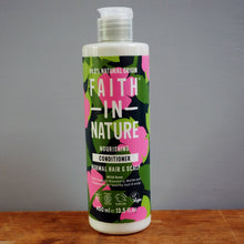 Load image into Gallery viewer, Bottle of Faith in Nature conditioner on a wooden surface with a gray background
